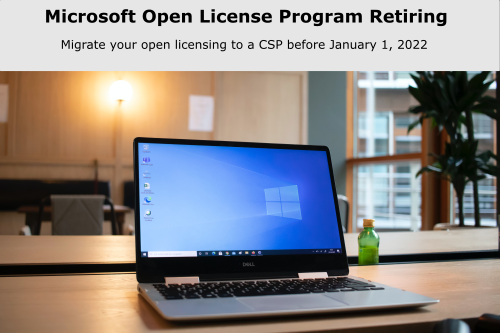 Laptop on table displays open license program retiring